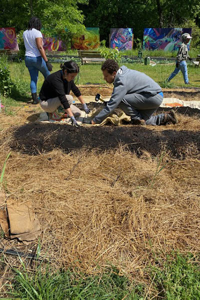 People gardening at Sankofa Community Orchard