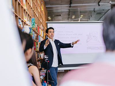 a presenter gives a lecture at a conference