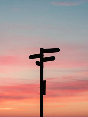 Signpost with arrows pointing in opposing directions